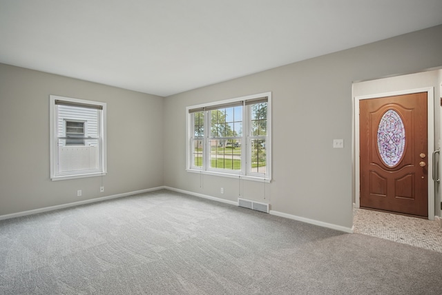7105 Madison Ave, Urbandale, IA 50322 - entrance foyer with carpet flooring and baseboards