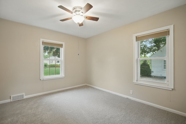 7105 Madison Ave, Urbandale, IA 50322 - carpeted spare room featuring ceiling fan and baseboards