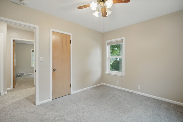 7105 Madison Ave, Urbandale, IA 50322 - unfurnished bedroom featuring carpet floors and baseboards