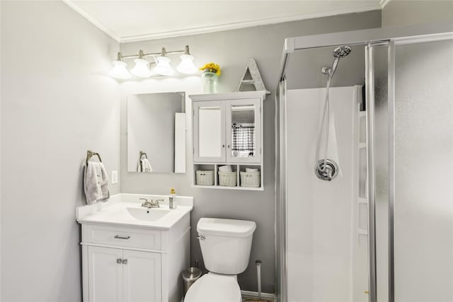 2419 30th St, Des Moines, IA 50310 - bathroom featuring a stall shower, vanity, toilet, and ornamental molding