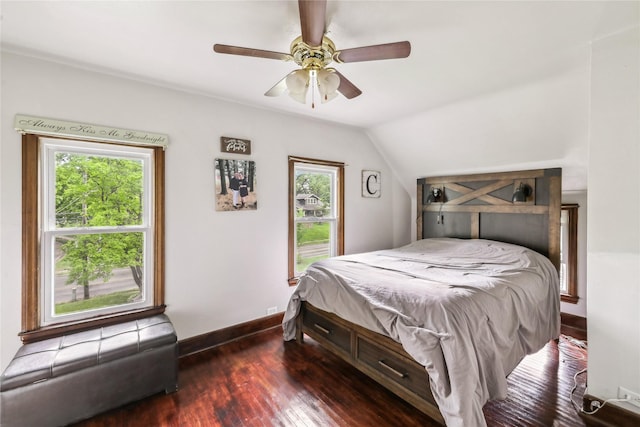 2419 30th St, Des Moines, IA 50310 - bedroom featuring multiple windows, wood finished floors, baseboards, vaulted ceiling, and a ceiling fan