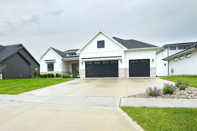 8019 NW 106th Ct, Johnston, IA 50131 - modern inspired farmhouse with board and batten siding, a front lawn, concrete driveway, and stone siding