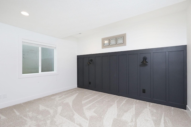 8019 NW 106th Ct, Johnston, IA 50131 - empty room featuring light colored carpet, baseboards, and recessed lighting
