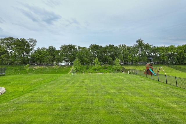 8019 NW 106th Ct, Johnston, IA 50131 - view of yard with a trampoline
