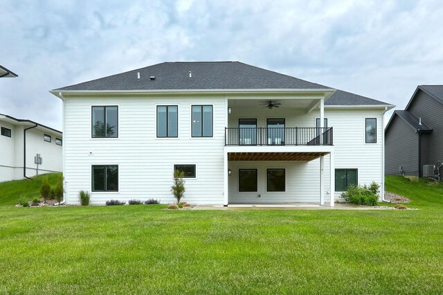 8019 NW 106th Ct, Johnston, IA 50131 - back of house with a balcony, a yard, a patio, and central AC