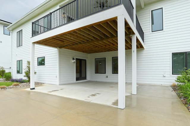8019 NW 106th Ct, Johnston, IA 50131 - view of patio / terrace with a balcony and a carport