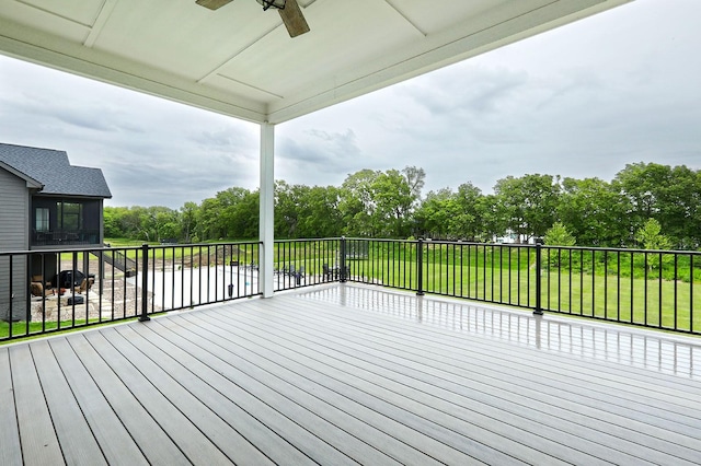 8019 NW 106th Ct, Johnston, IA 50131 - wooden terrace featuring a ceiling fan and view of scattered trees