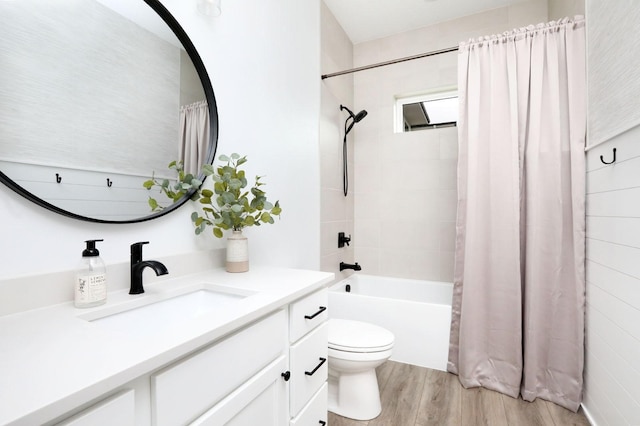 8019 NW 106th Ct, Johnston, IA 50131 - full bath with vanity, wood finished floors, shower / bath combo with shower curtain, and toilet