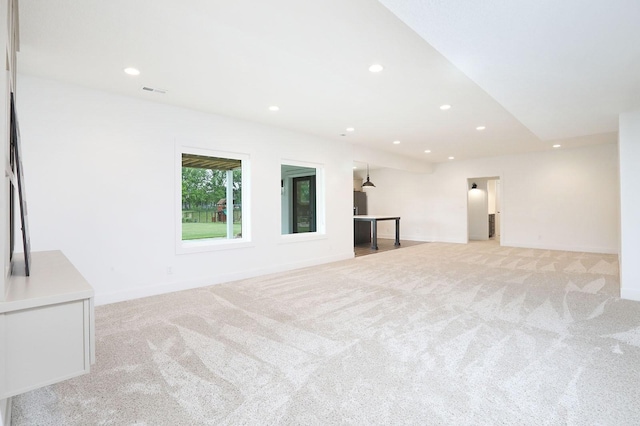 8019 NW 106th Ct, Johnston, IA 50131 - unfurnished living room with light colored carpet, recessed lighting, and baseboards