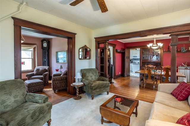 509 2nd Ave, Slater, IA 50244 - living room with a ceiling fan, wood finished floors, and crown molding