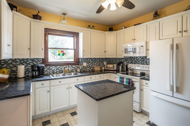 509 2nd Ave, Slater, IA 50244 - kitchen with white appliances, a sink, backsplash, ceiling fan, and a kitchen island