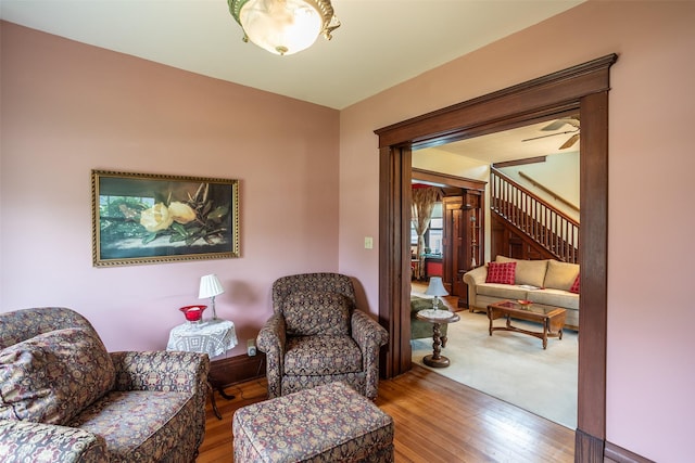 509 2nd Ave, Slater, IA 50244 - sitting room featuring stairway, wood finished floors, and ceiling fan