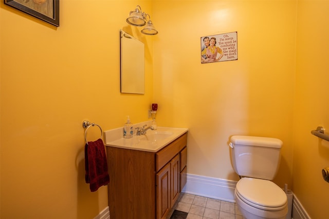 509 2nd Ave, Slater, IA 50244 - bathroom featuring toilet, vanity, tile patterned floors, and baseboards