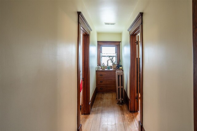 509 2nd Ave, Slater, IA 50244 - hall with radiator, light wood-style flooring, and baseboards
