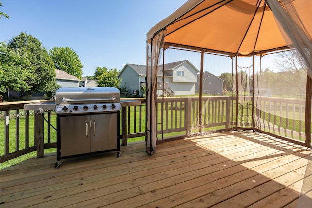1804 W Cheyenne Ct, Polk City, IA 50226 - wooden deck with a gazebo, a residential view, a grill, and a lawn
