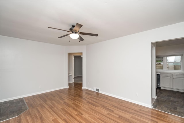3426 N Union St, Des Moines, IA 50316 - unfurnished room with ceiling fan, wood finished floors, and baseboards