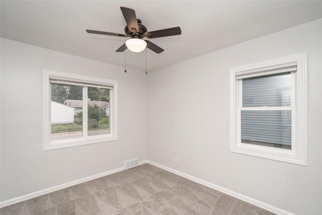 3426 N Union St, Des Moines, IA 50316 - unfurnished room with baseboards, a ceiling fan, and carpet floors