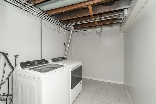 3426 N Union St, Des Moines, IA 50316 - laundry room with washer and clothes dryer, light tile patterned floors, and baseboards