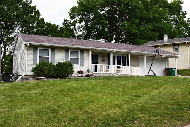 310 Fleming Rd, Carlisle, IA 50047 - view of front facade with covered porch, a front lawn, and cooling unit