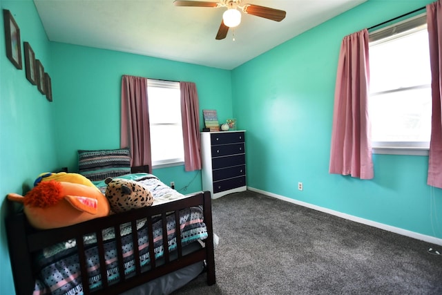 310 Fleming Rd, Carlisle, IA 50047 - carpeted bedroom featuring baseboards and a ceiling fan