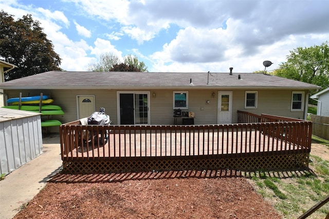 310 Fleming Rd, Carlisle, IA 50047 - back of property featuring a deck