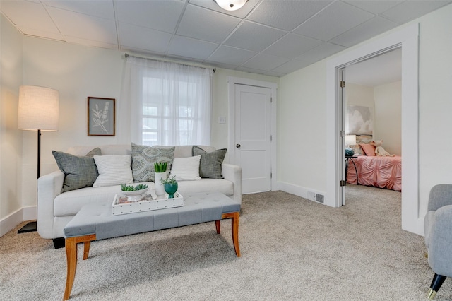 2403 E 14th St, Des Moines, IA 50316 - carpeted living area featuring a drop ceiling and baseboards