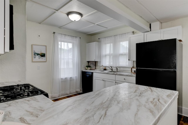 2403 E 14th St, Des Moines, IA 50316 - kitchen featuring black appliances, a sink, white cabinetry, light stone counters, and beam ceiling