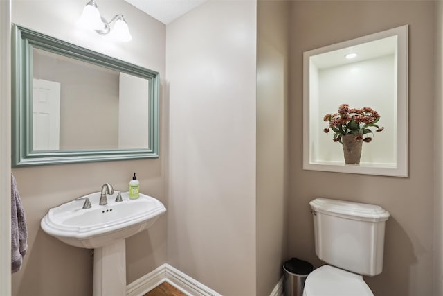 6909 Capitol View Ct, Johnston, IA 50131 - half bathroom featuring toilet and baseboards