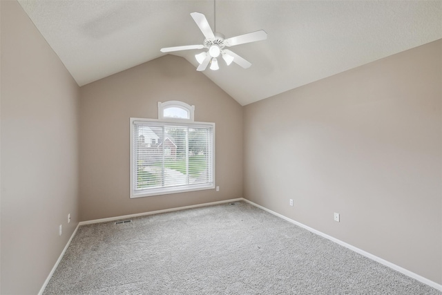 6909 Capitol View Ct, Johnston, IA 50131 - empty room featuring ceiling fan, carpet flooring, lofted ceiling, and baseboards