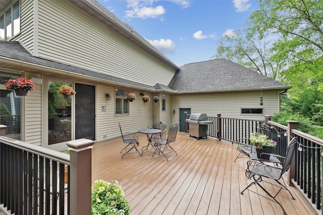 6909 Capitol View Ct, Johnston, IA 50131 - wooden terrace with area for grilling and outdoor dining area