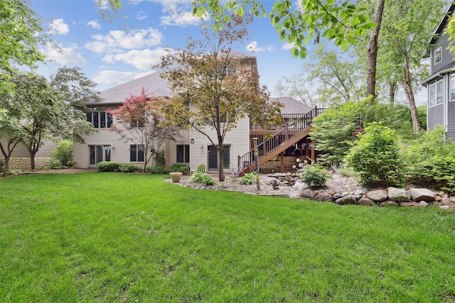 6909 Capitol View Ct, Johnston, IA 50131 - rear view of house with stairway, a yard, a deck, and a chimney