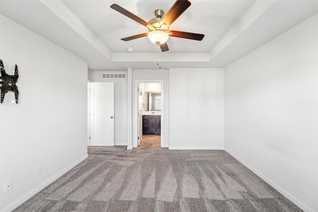 580 NW Rosemont Dr, Waukee, IA 50263 - carpeted empty room with a raised ceiling and a ceiling fan