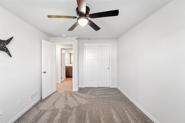 580 NW Rosemont Dr, Waukee, IA 50263 - unfurnished bedroom with carpet floors, a closet, and ceiling fan