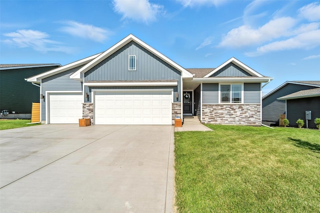 580 NW Rosemont Dr, Waukee, IA 50263 - craftsman-style home with an attached garage, stone siding, board and batten siding, concrete driveway, and a front yard