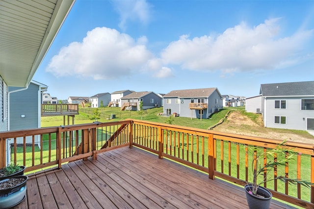 580 NW Rosemont Dr, Waukee, IA 50263 - wooden deck featuring a residential view and a lawn