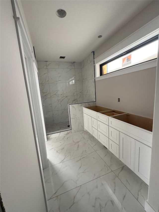 1405 NW Bull Run Ct, Waukee, IA 50263 - full bathroom featuring marble finish flooring, a marble finish shower, and vanity