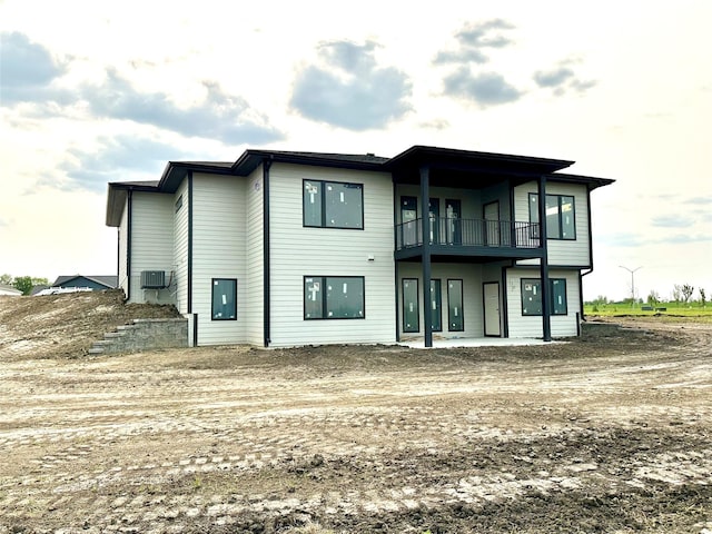 1405 NW Bull Run Ct, Waukee, IA 50263 - back of house with a balcony and cooling unit