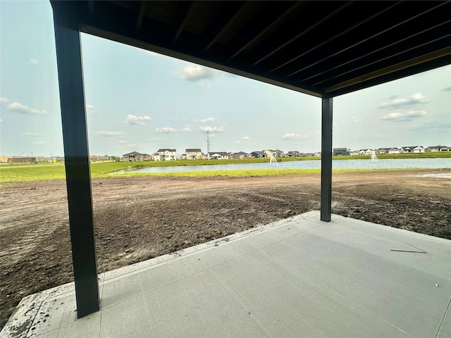 1405 NW Bull Run Ct, Waukee, IA 50263 - view of patio / terrace featuring a water view