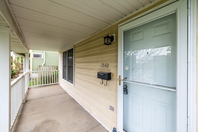 1540 8th St, Des Moines, IA 50314 - doorway to property featuring covered porch