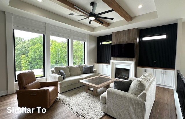 1410 NW Bull Run Ct, Waukee, IA 50263 - living room featuring wood finished floors, a ceiling fan, recessed lighting, a glass covered fireplace, and beam ceiling