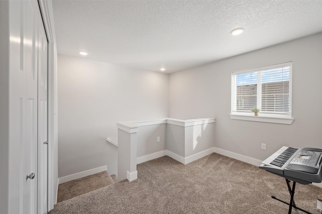 714 Umbra Pl, Norwalk, IA 50211 - interior space featuring carpet flooring, a textured ceiling, baseboards, and recessed lighting