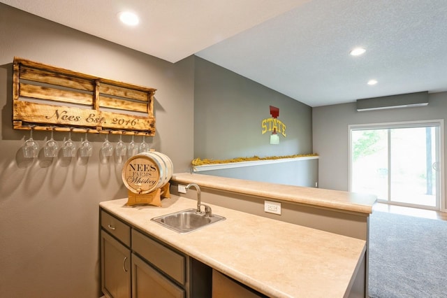 1625 S 50th Pl, West Des Moines, IA 50265 - kitchen with a sink, recessed lighting, light countertops, and a peninsula