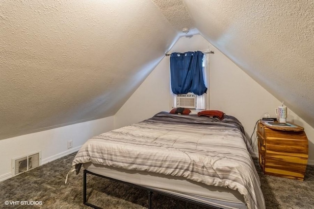 201 Main St, New Virginia, IA 50210 - bedroom featuring a textured ceiling, carpet flooring, vaulted ceiling, cooling unit, and baseboards