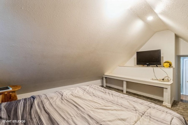 201 Main St, New Virginia, IA 50210 - carpeted bedroom featuring a textured ceiling and lofted ceiling