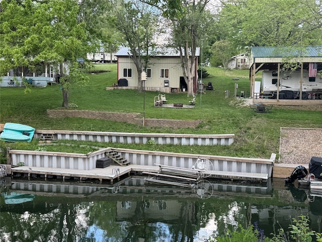 3170 Morman Trl, Ellston, IA 50074 - rear view of house featuring a water view and a lawn