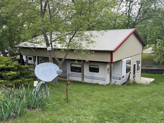 3170 Morman Trl, Ellston, IA 50074 - view of front of house with a front lawn and metal roof