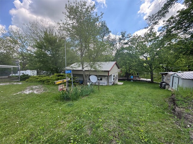 3170 Morman Trl, Ellston, IA 50074 - view of green lawn featuring an outdoor structure