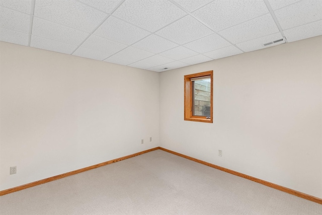 6799 NW 57th St, Johnston, IA 50131 - empty room with carpet flooring, a paneled ceiling, and baseboards