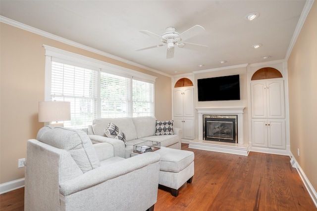 2403 Guenever Ct, Altoona, IA 50009 - living area featuring ceiling fan, crown molding, hardwood / wood-style flooring, baseboards, and a fireplace