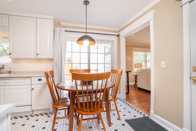 2403 Guenever Ct, Altoona, IA 50009 - dining area with ornamental molding, healthy amount of natural light, baseboards, and light tile patterned flooring